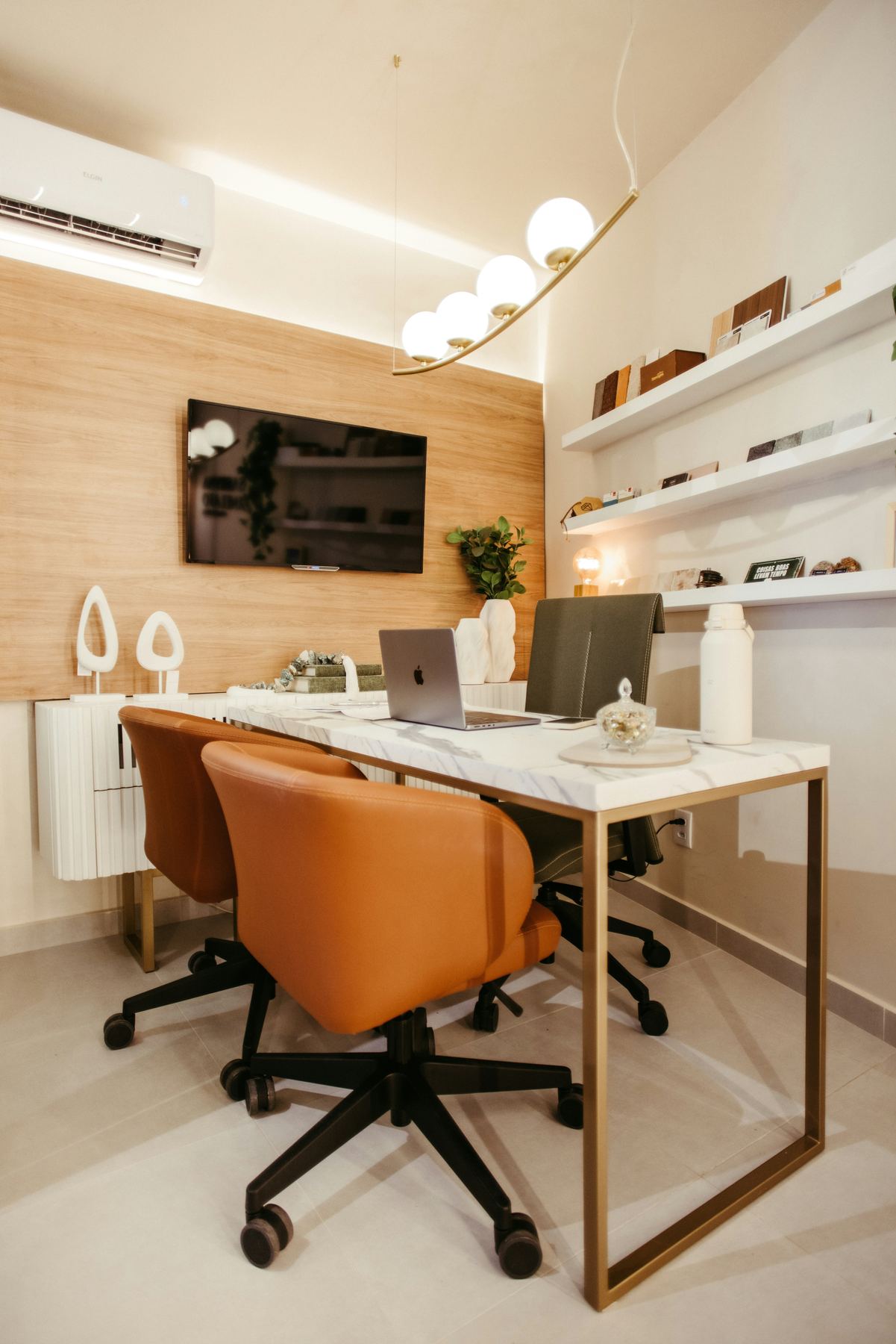Office cleaner wiping down a modern open-plan office desk in Wollongong